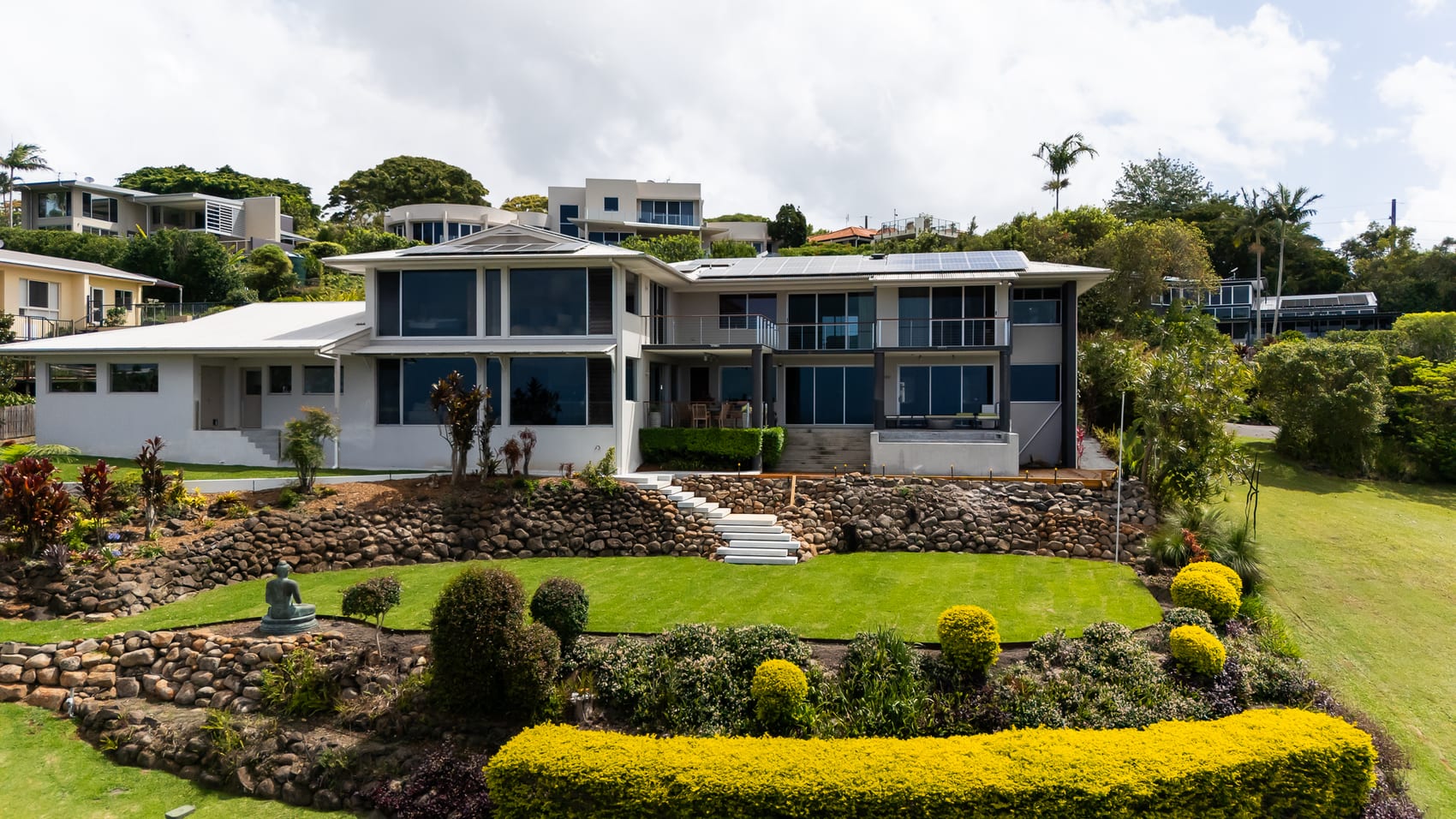 Landscaped pool and outdoor living space by The QLD Group